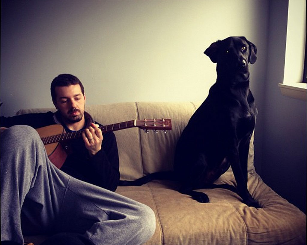 Brian Casel playing music with his dog, Trey